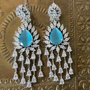 American Diamond Dangle earrings with a beautiful blue stone in the center